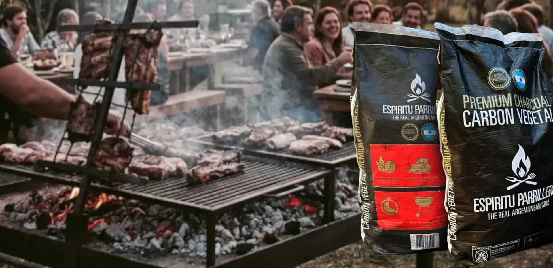 Two bags of Espíritu Parrillero premium charcoal next to a grill