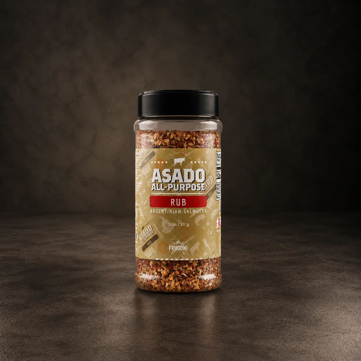A jar of Frugoni asado rub, on dark stone