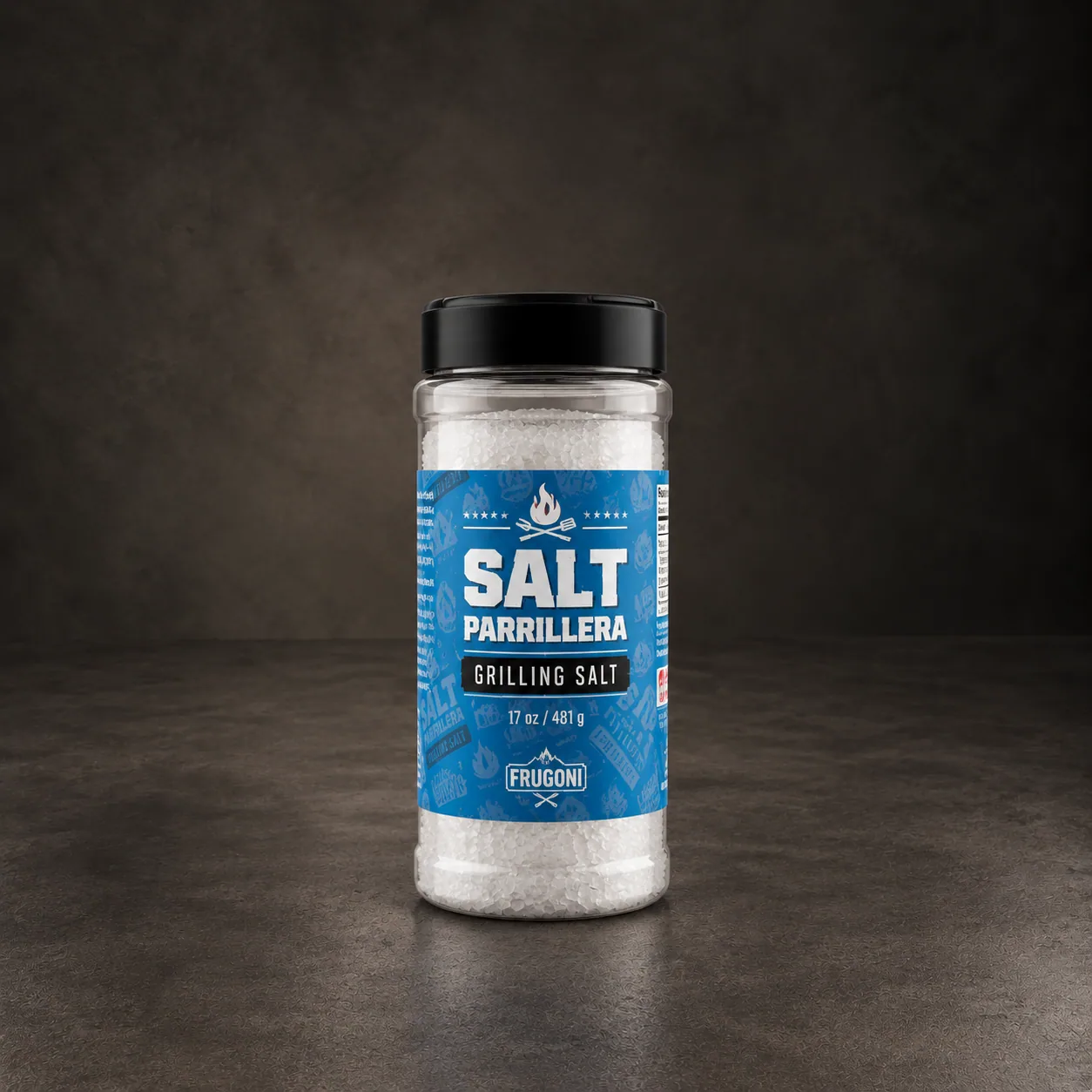 A jar of Frugoni grilling salt, on dark stone