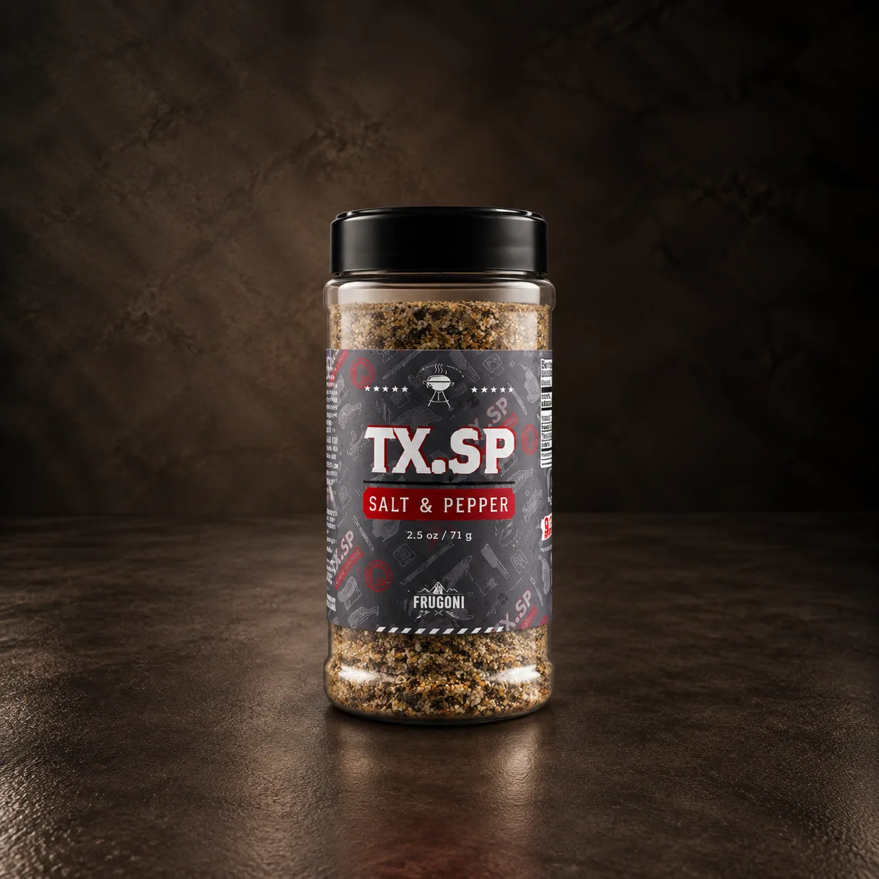 A jar of Frugoni salt and pepper rub, on dark stone