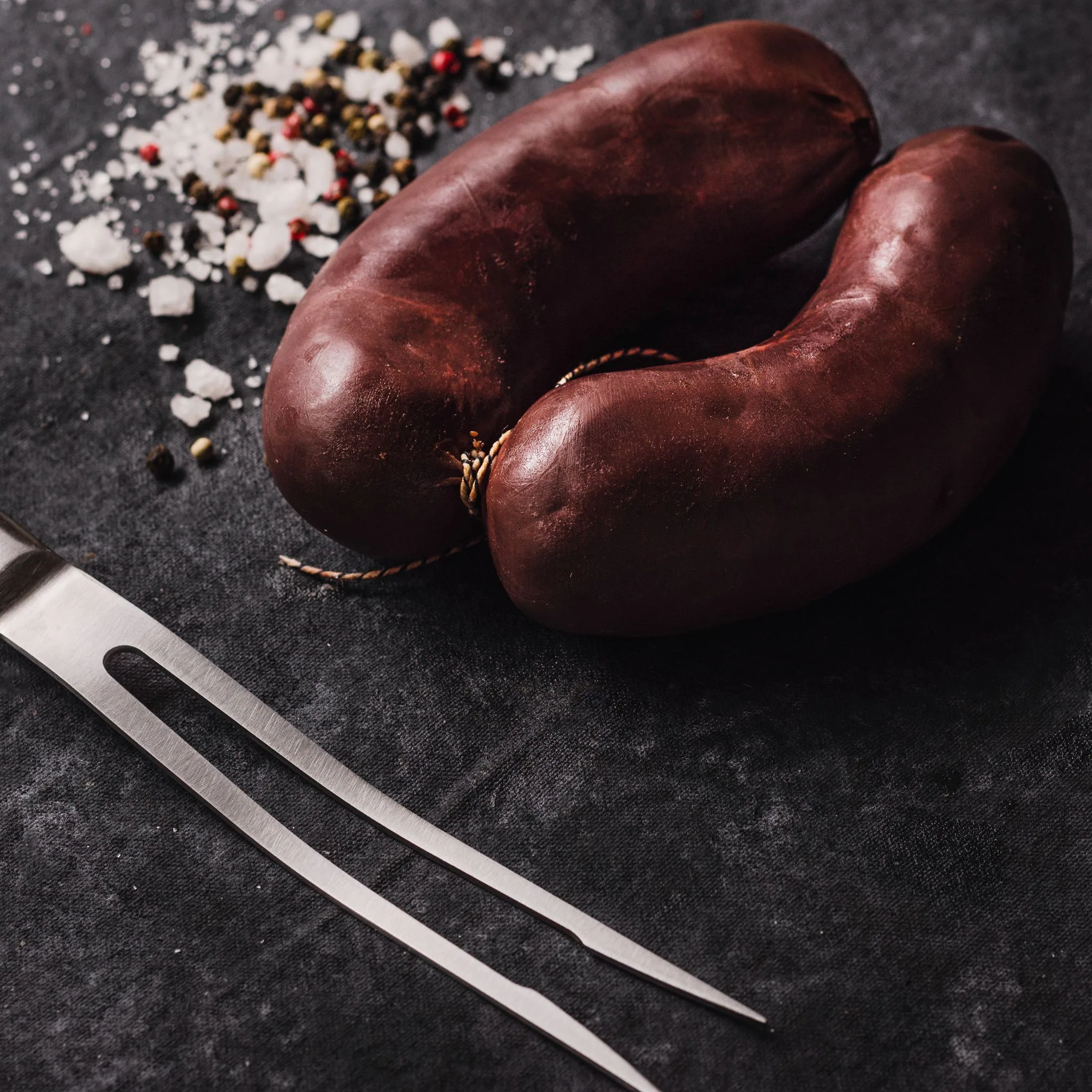 Argentine sweet blood sausage, on dark stone