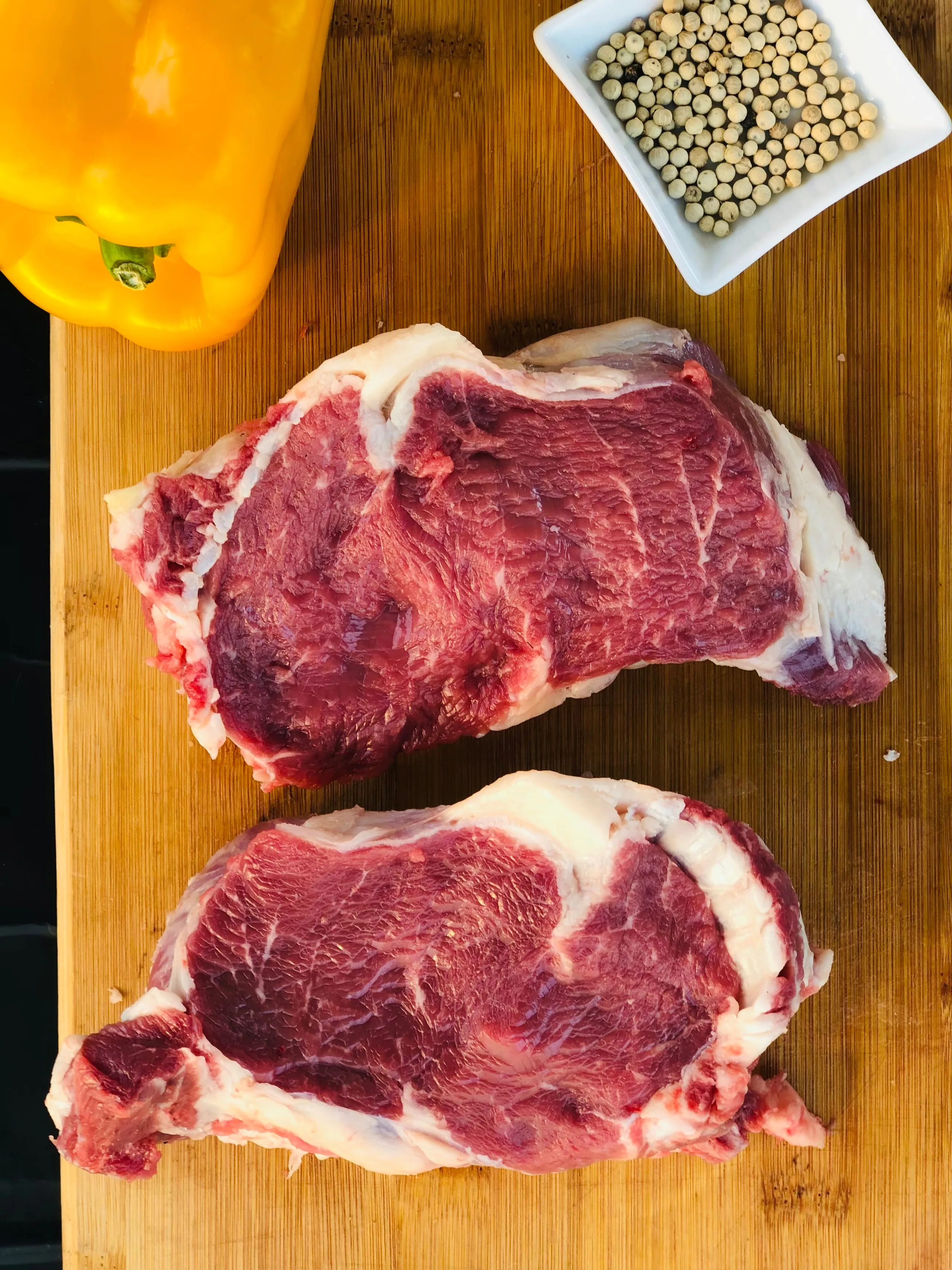 An Argentine Angus striploin, on dark stone
